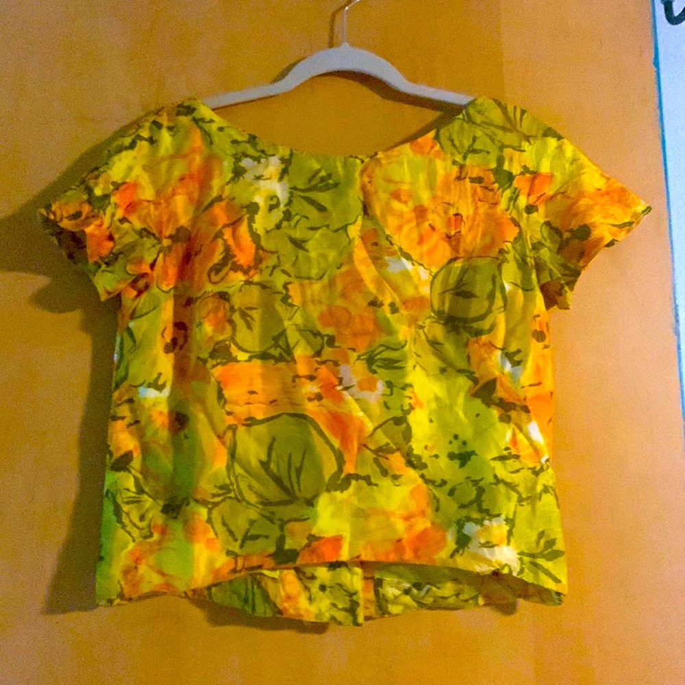 Vintage cropped top with orange and yellow flowers and green leaves